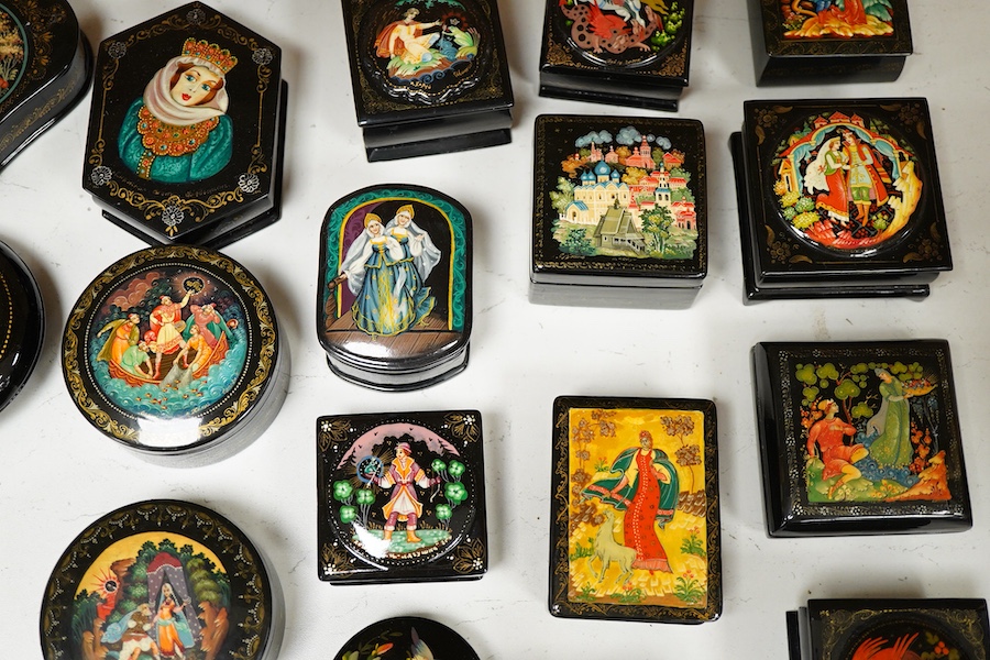 Twenty five Russian assorted lacquer pill and trinket boxes. Largest 10cm deep.